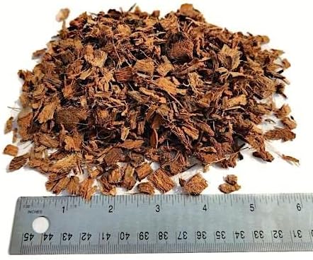 reptichip reptile bedding loose coconut chip 12 quart on a desk or shelf