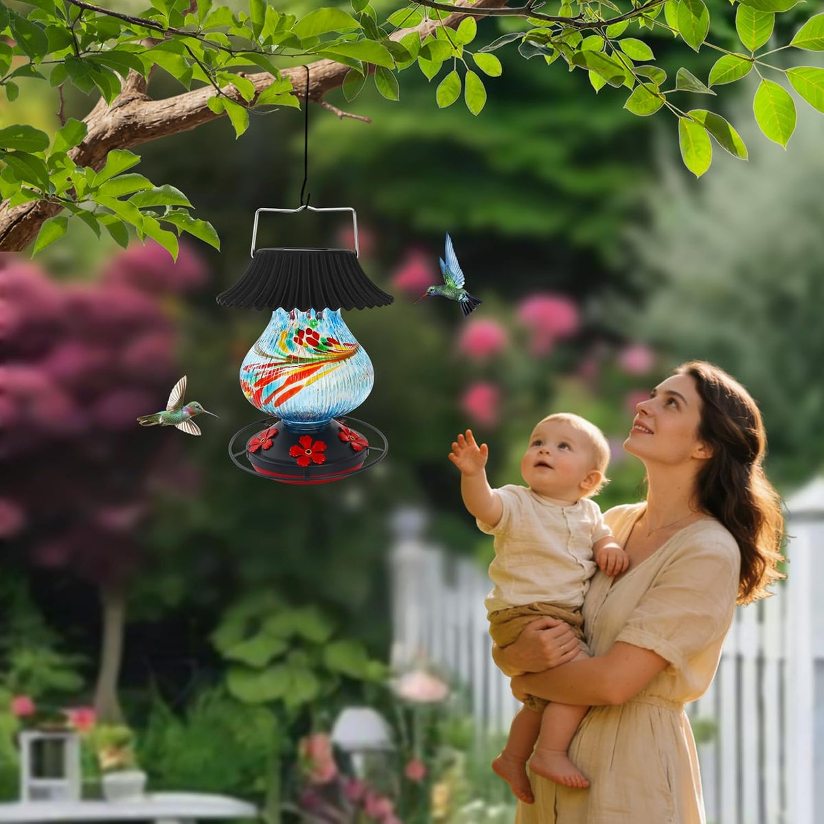 solar hummingbird feeder, hand blown glass multicolor night, side view