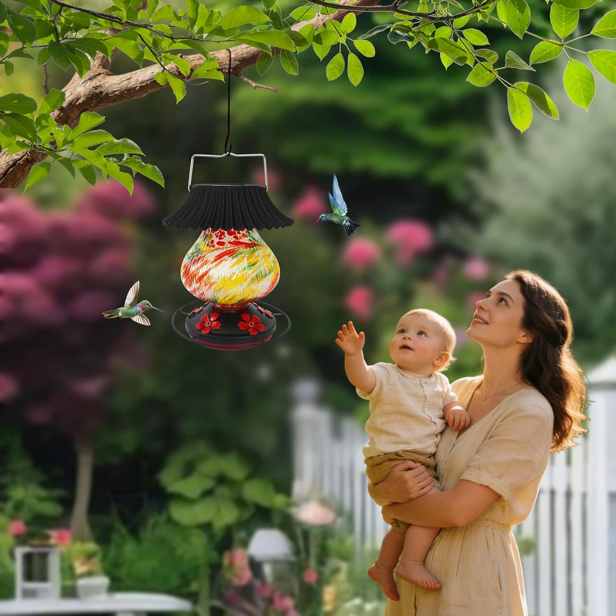 solar hummingbird feeder, hand blown glass multicolor night, side view