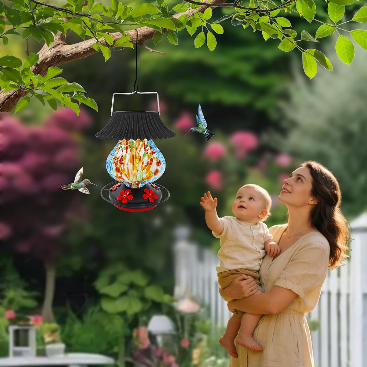solar hummingbird feeder, hand blown glass multicolor night, side view
