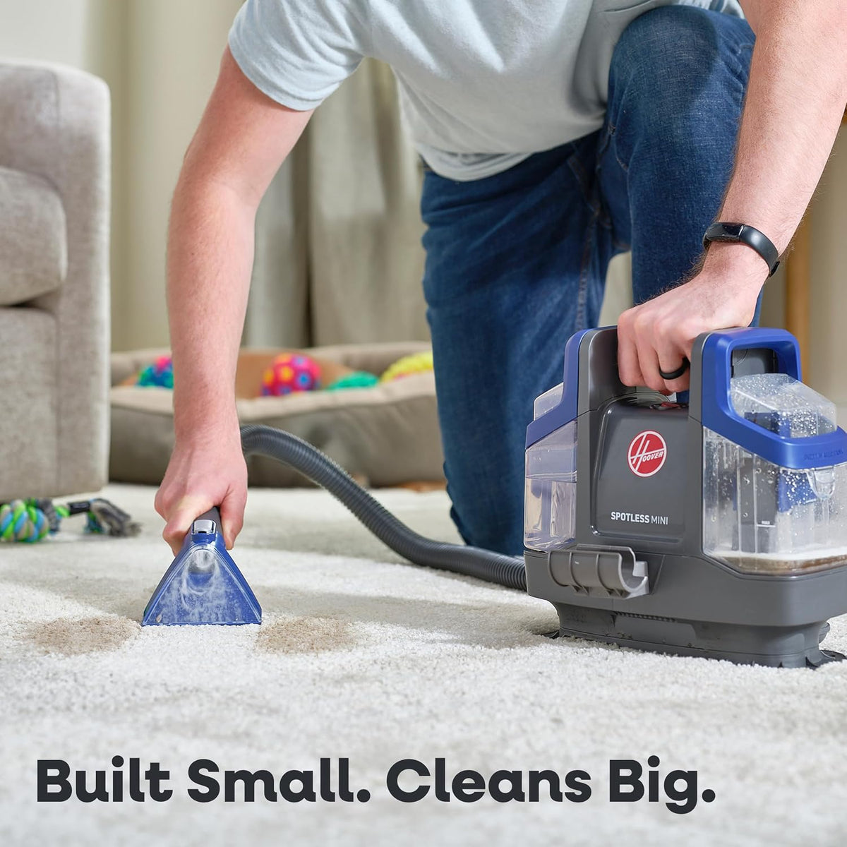 hoover spotless mini pet portable spot cleaner fh12351 shown in use