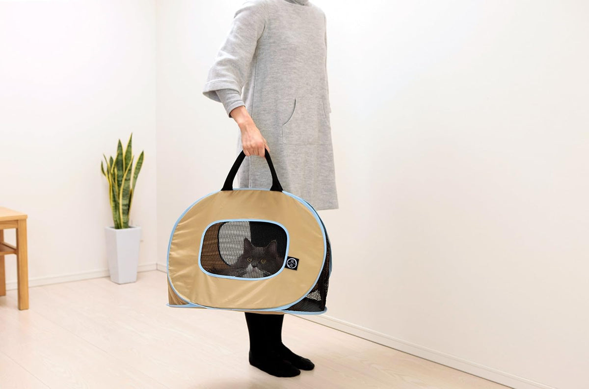 necoichi portable ultra light cat carrier shown in use